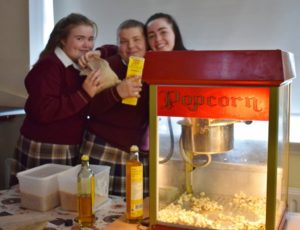 Some of the girls getting the popcorn ready for the movie screening. 
