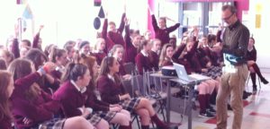 Irish Water Rep Colm Claffey demonstrates the use of interactive mobile phone  technology, as the girls learn about the process of turning wastewater into consumable drink.